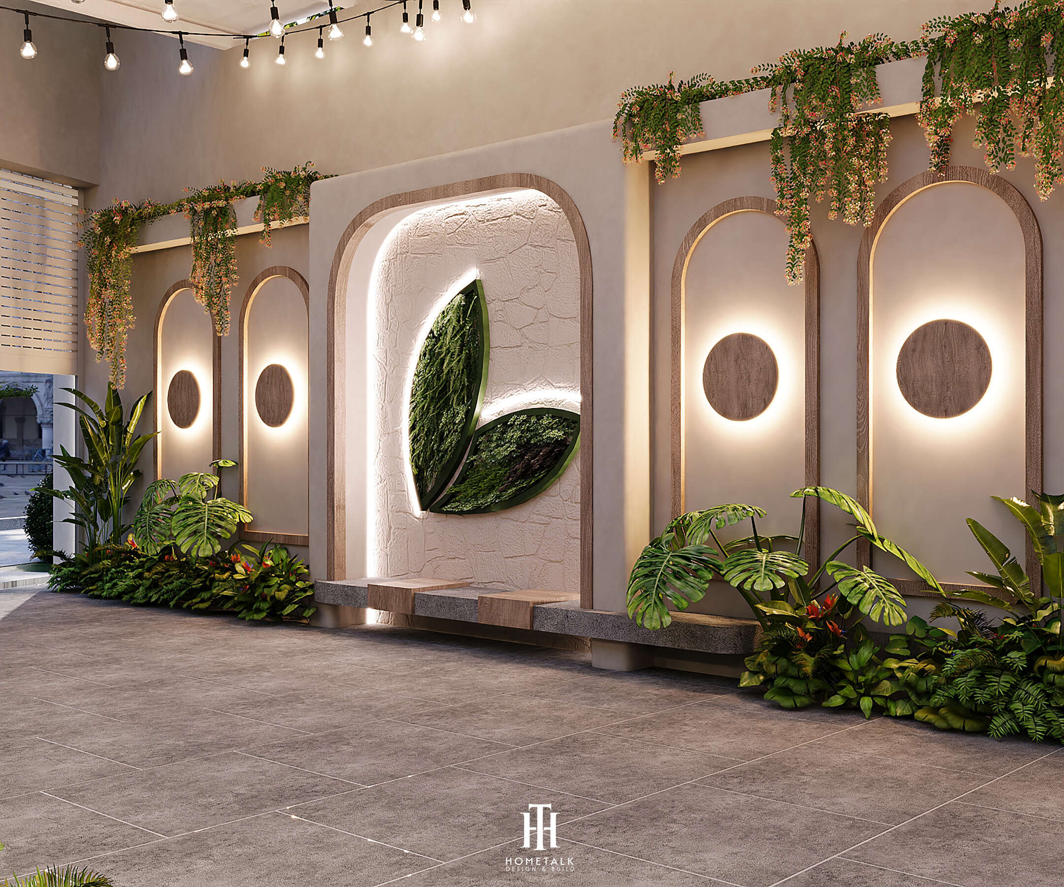 Lối vào spa nổi bật với logo lá cây và ánh sáng âm trần dịu nhẹ