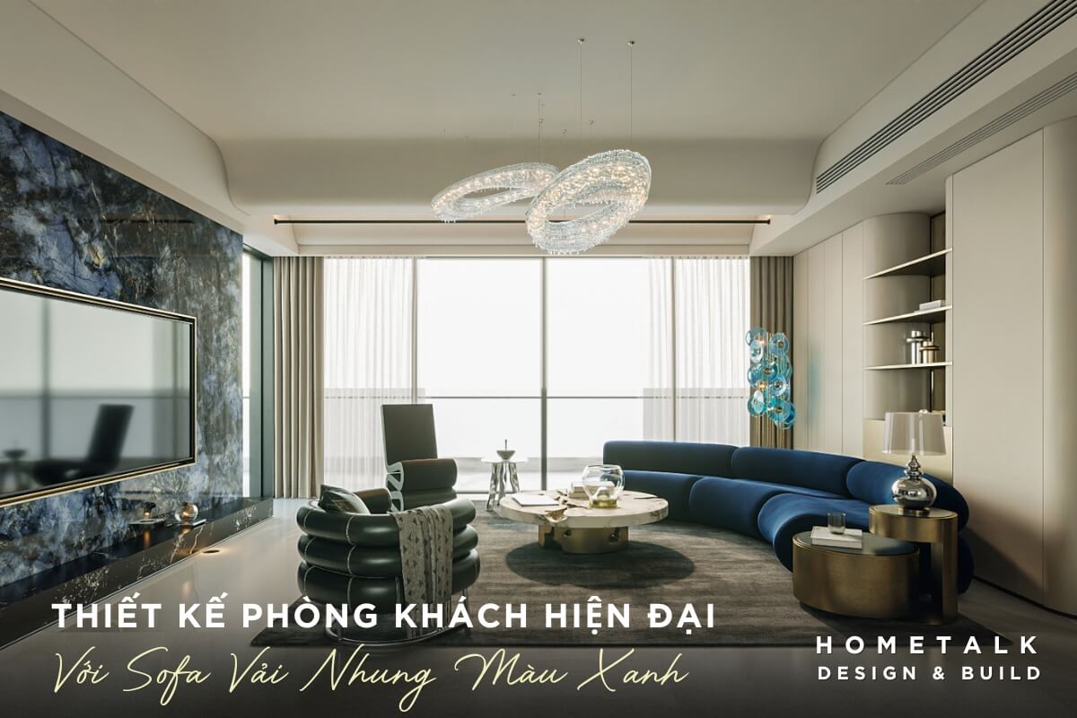 Phong khach voi sofa lon hinh chu L duoc boc vai nhung mau xanh duong dam noi bat, mang lai ve dep sang trong va em ai