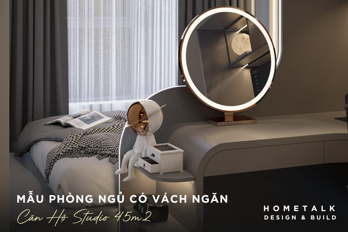 Vách ngăn cong màu xám nhạt được đặt giữa giường ngủ và khu vực bàn trang điểm, tạo sự phân chia không gian mềm mại trong căn hộ studio 45m2 Vach ngan cong mau xam nhat duoc dat giua giuong ngu va khu vuc ban trang diem, tao su phan chia khong gian mem mai trong can ho studio 45m2
